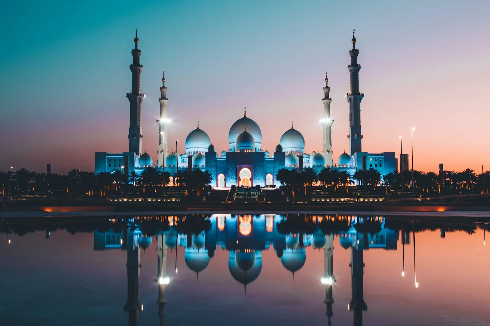 A temple in the UAE lit by lights at night.