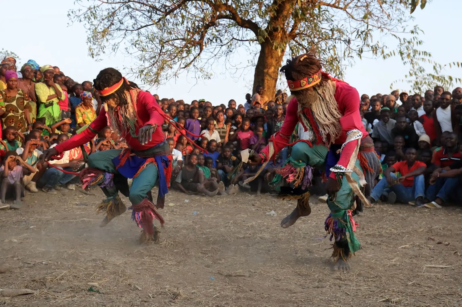 traditional Nyau dancers with face masks at a Gule Wamkulu ceremony Malawi