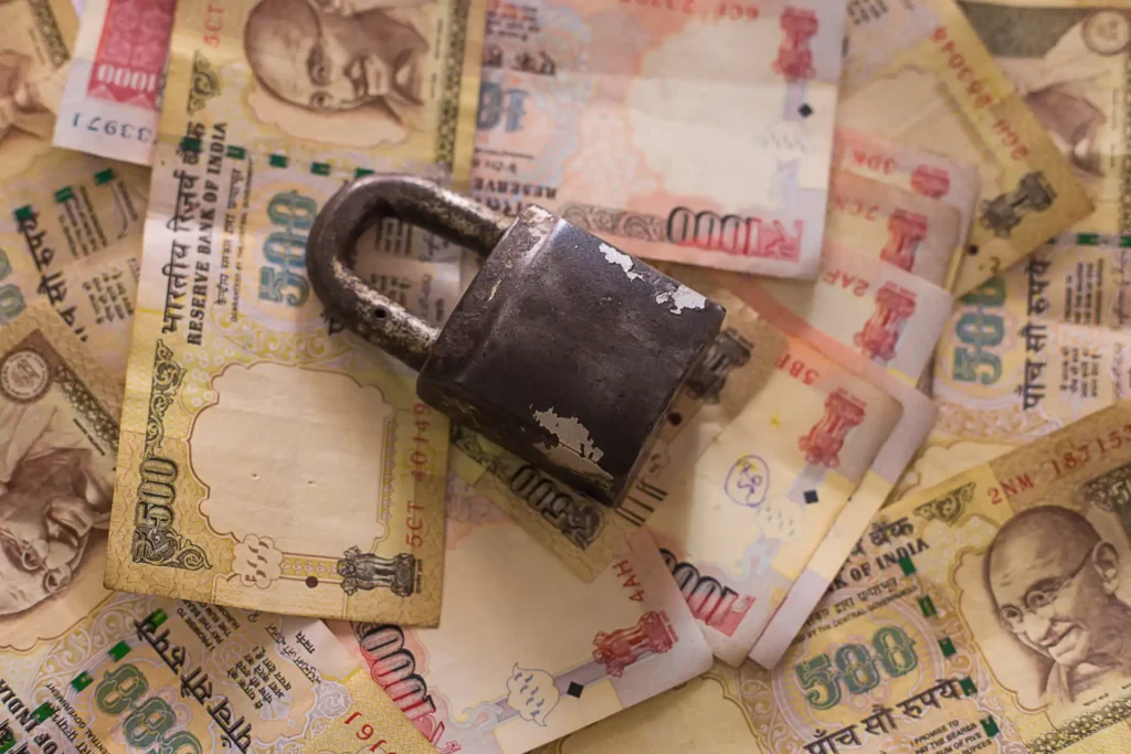 Padlock on Indian closed currency, 1000 and 500 Rupee note. To represent a closed currency