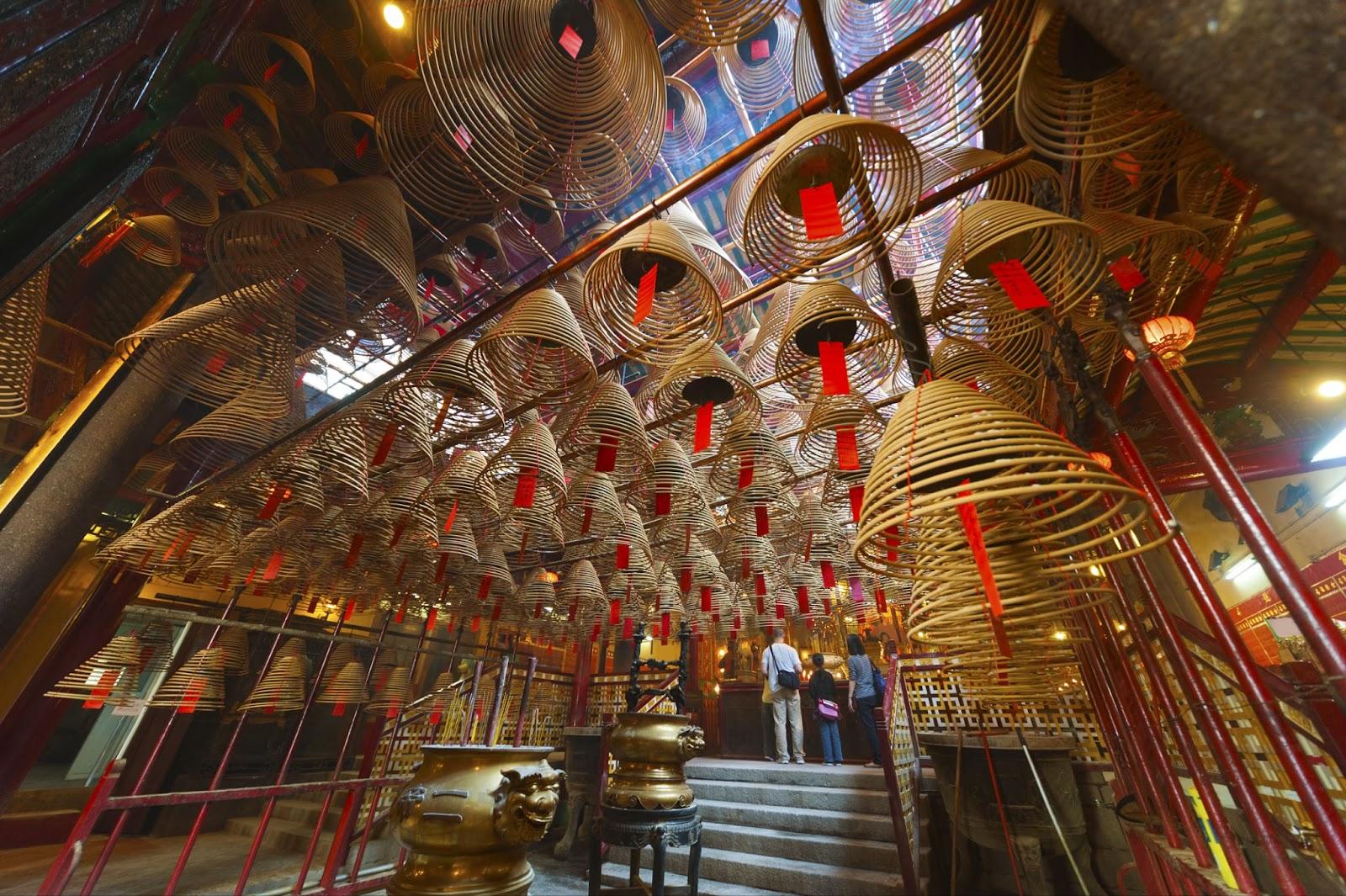 The interior of the Man Mo Temple, Hong Kong, with incense offer.