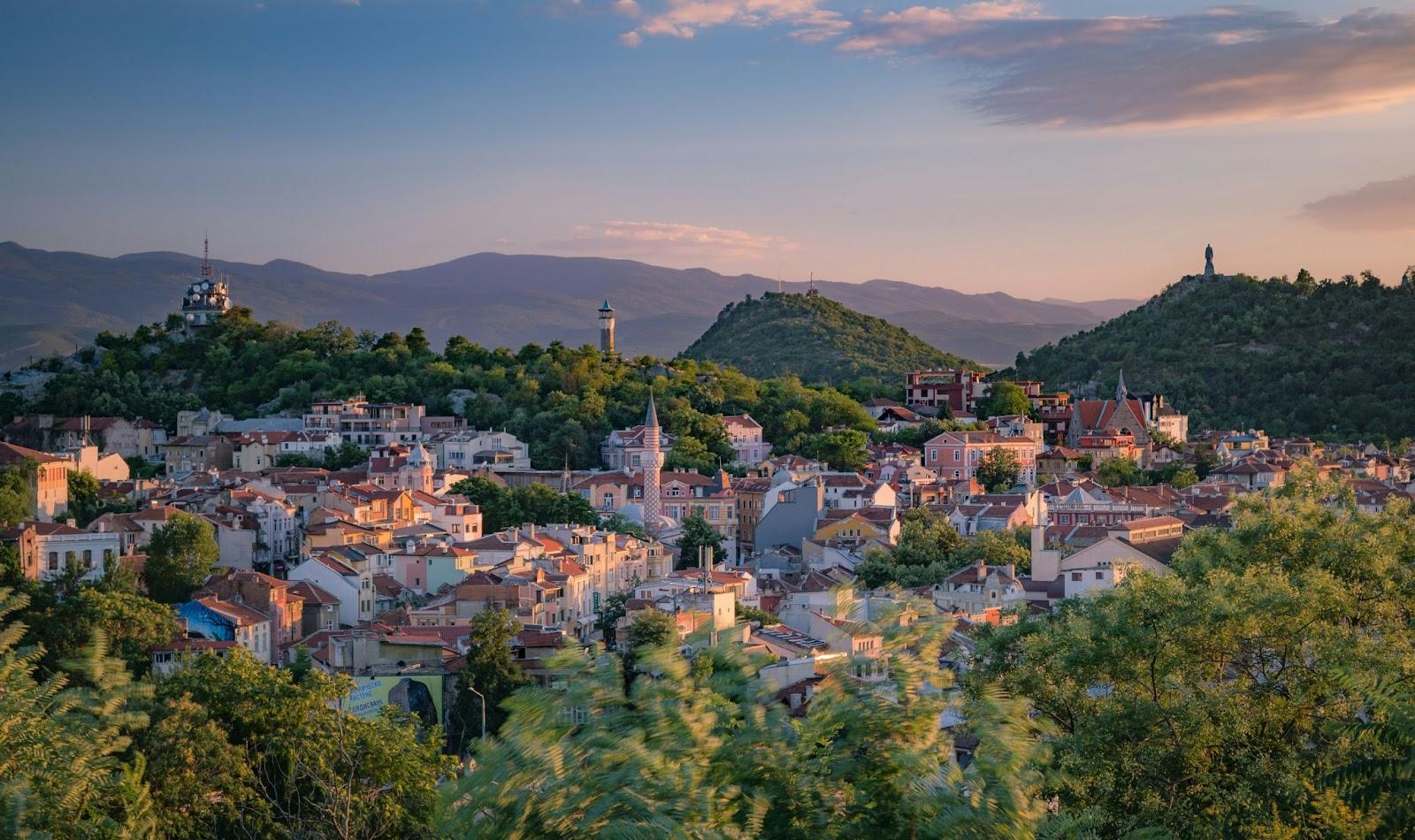 a small town surrounded by trees and mountains - Plovdiv