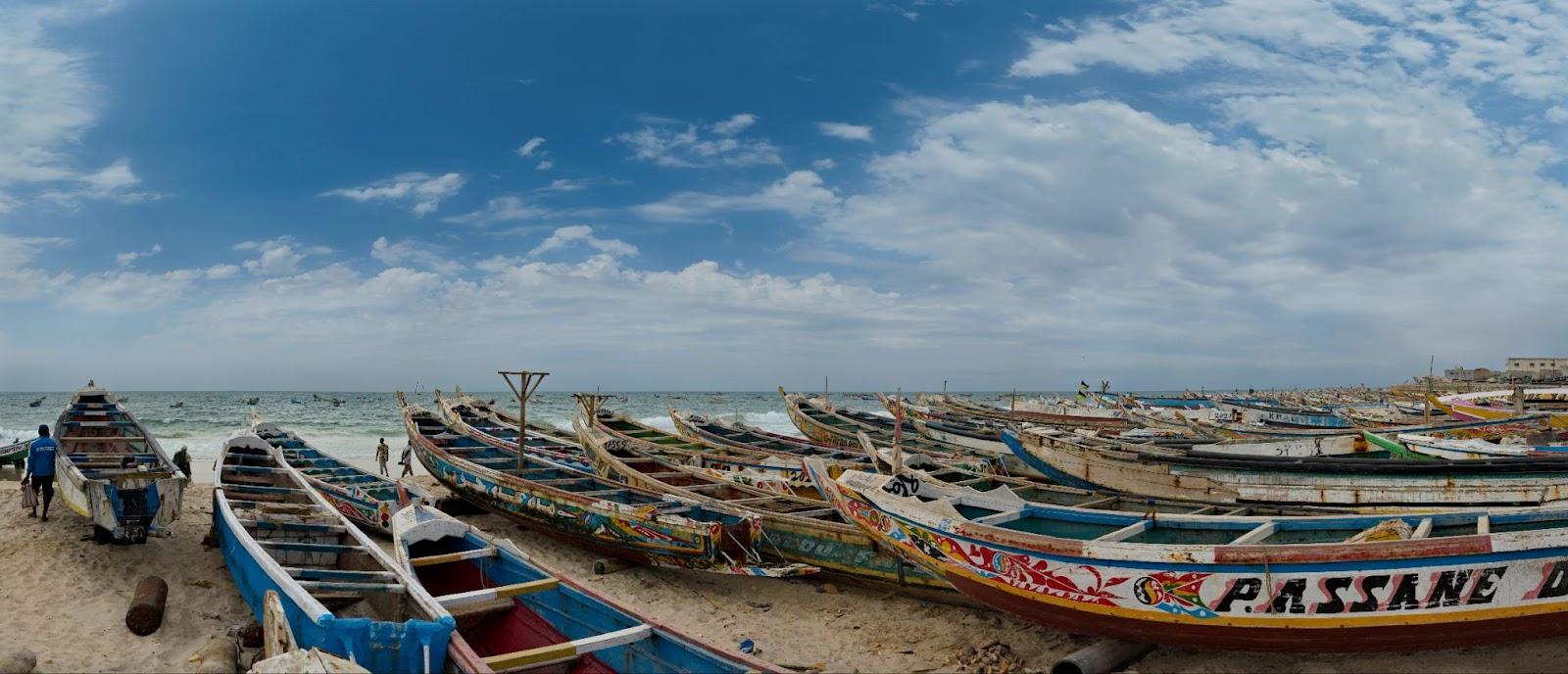 Nouakchott. Mauritania. Hundreds of huge painted wooden boats, on which local fishermen go to sea