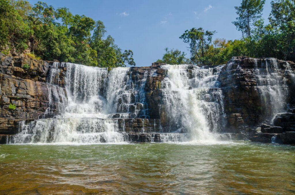 Beautiful Sala water falls near Labe with trees, green pool and a lot of water flow, Guinea Conakry, West Africa.