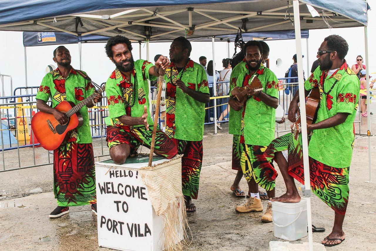 indigenous people of Vanuatu playing music welcoming people to the capital, Port Villa 