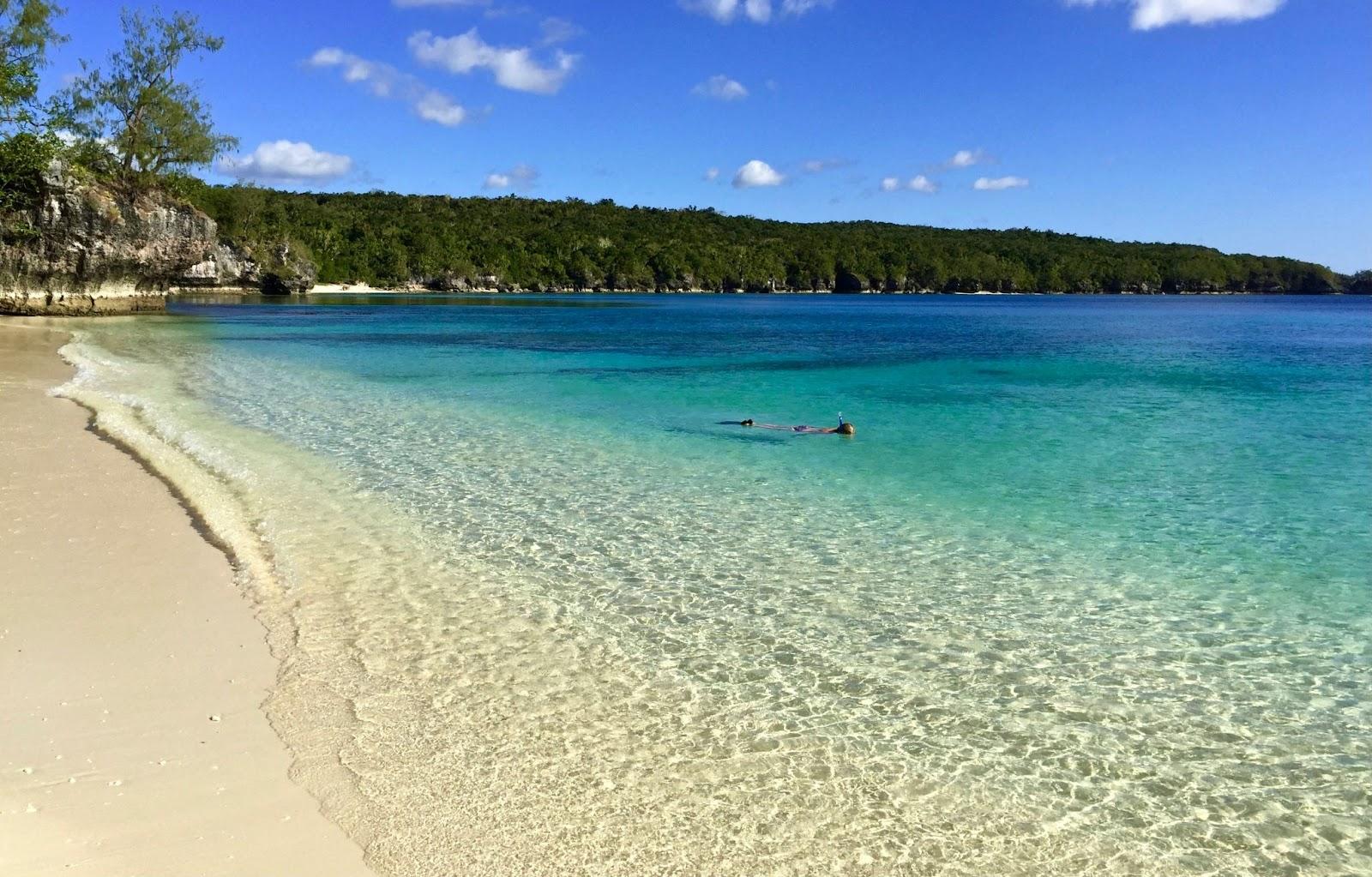 people swimming on Vanuatu beach during daytime