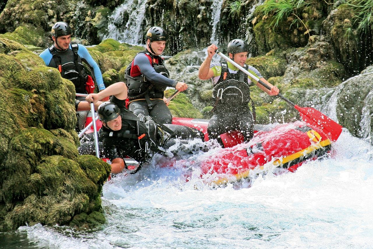 Men white water rafting
