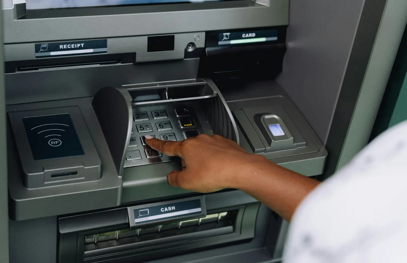 African woman using ATM in Tanzania.