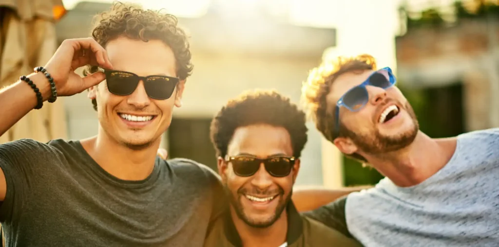 3 men smiling and laughing on a lads holiday