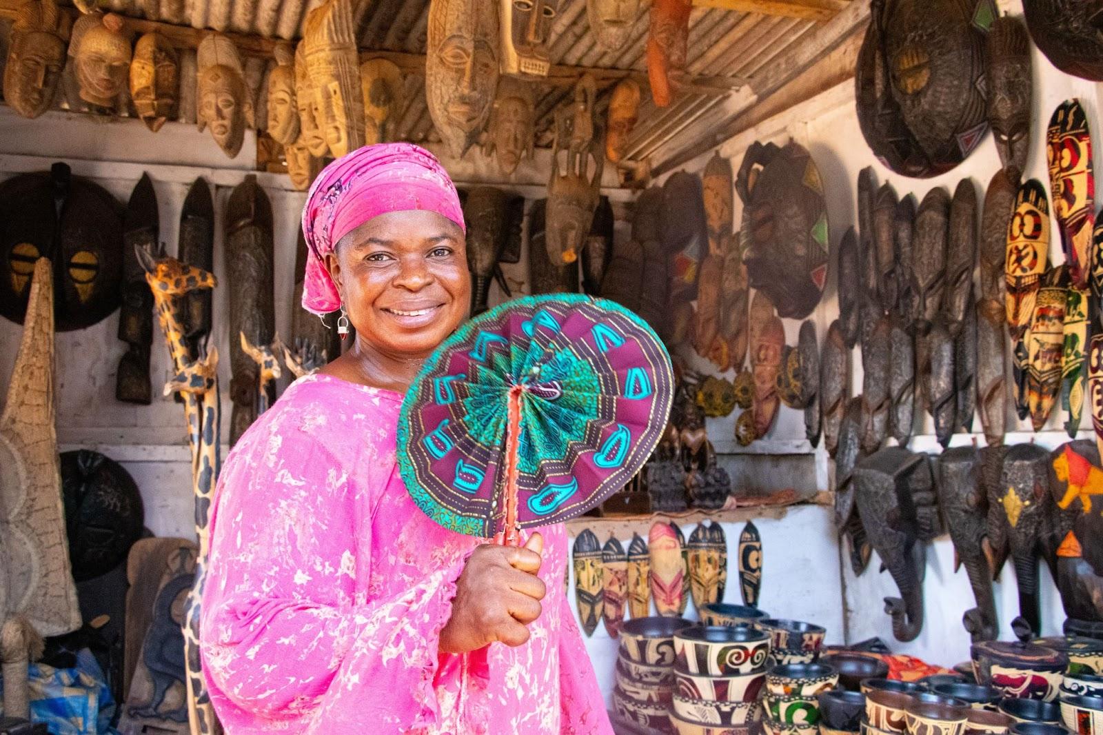 Woman selling crafts in the local market in Ghana