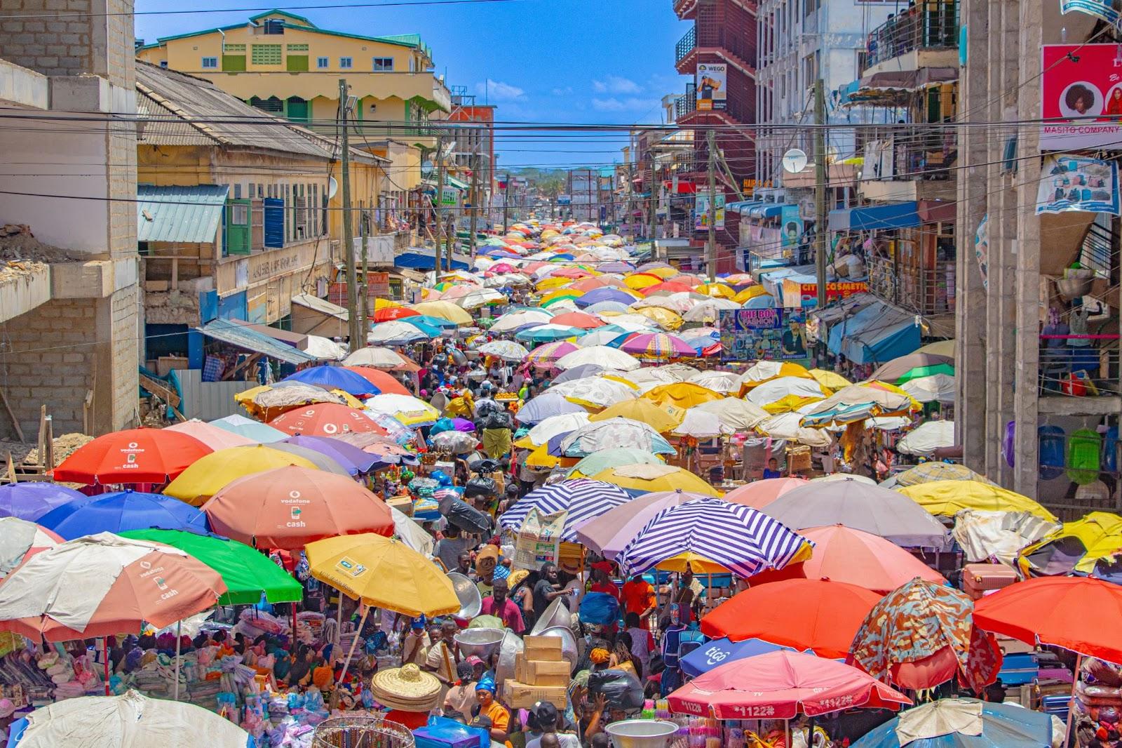 The people of Ghana and the scene at Makola Market.