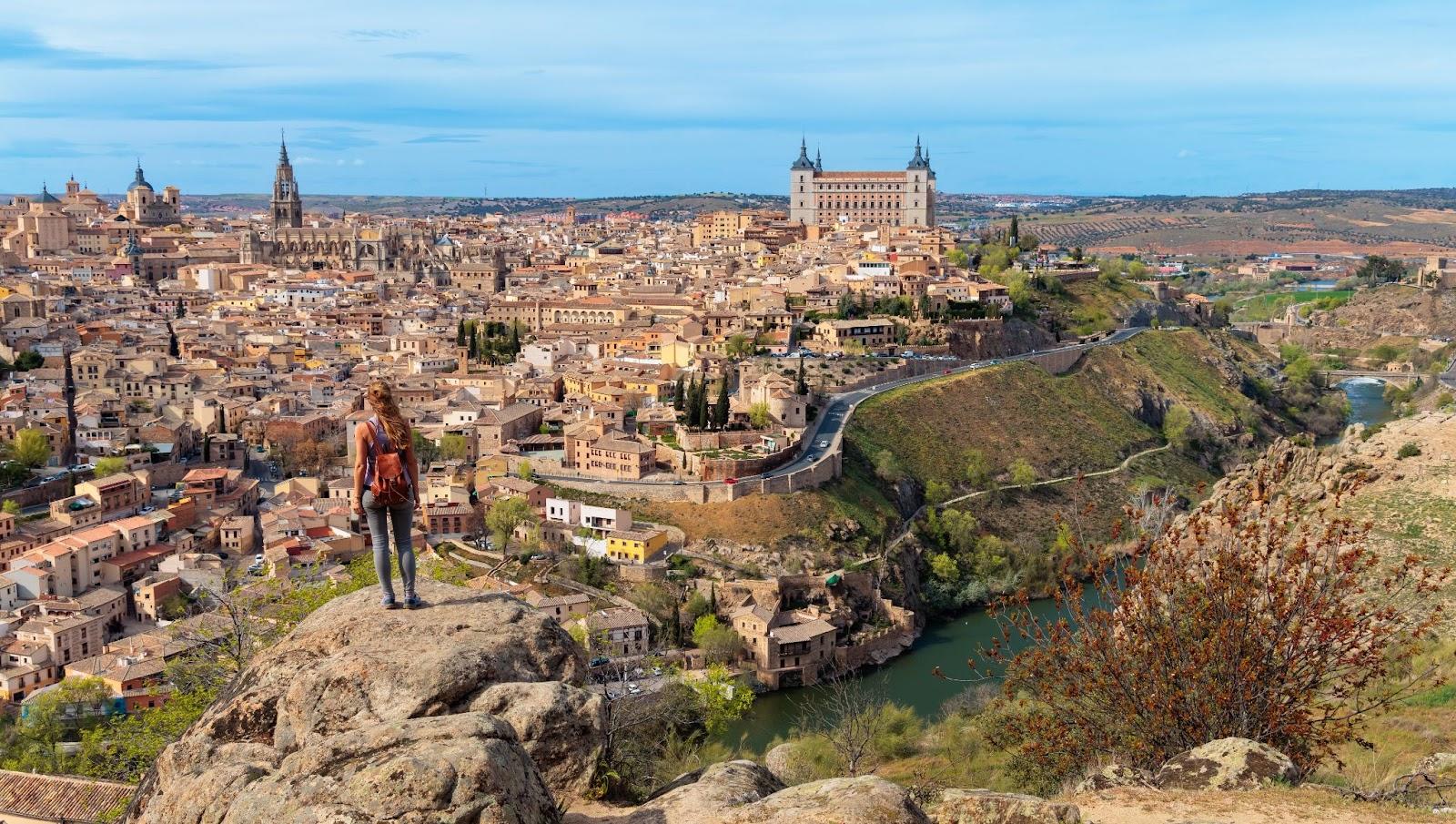 Tourist Woman Admiring the Panoramic View of Toledo, Spain