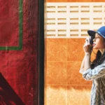 The solo Asian female traveller taking a picture on her camera