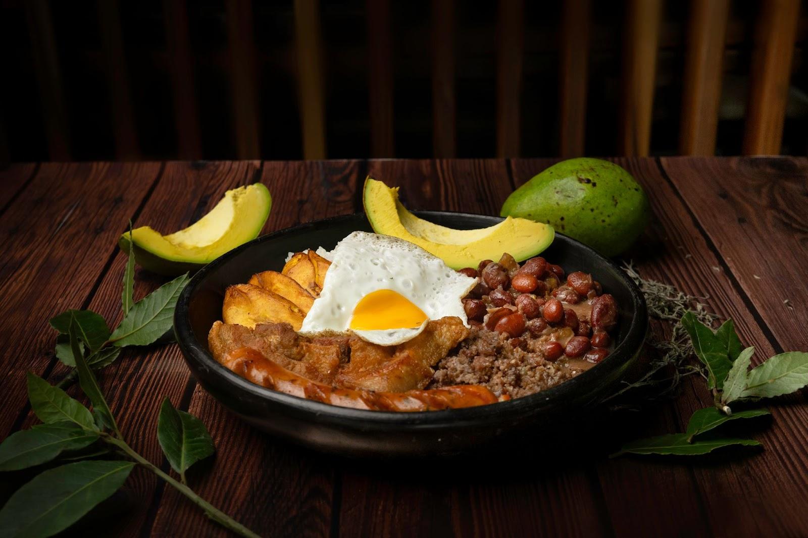 typical food, from antioquia, with beans, eggs, rice, pork rinds, avocado and chorizo ​​