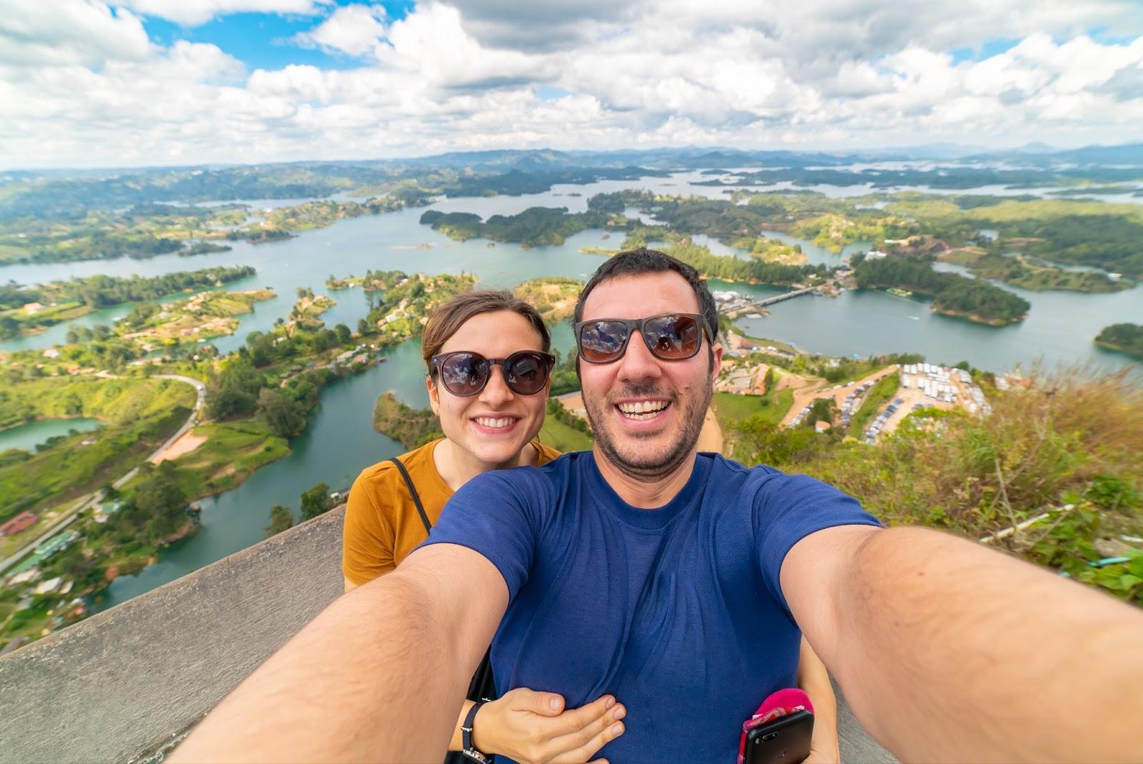 Couple take selfie in the Lake of Guatape from Rock of Guatape 