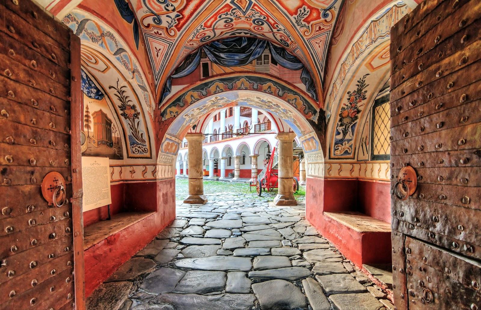 Beautiful view of the entrance gate at the Orthodox Rila Monastery, a famous tourist attraction and cultural heritage monument in the Rila Nature Park mountains in Bulgaria