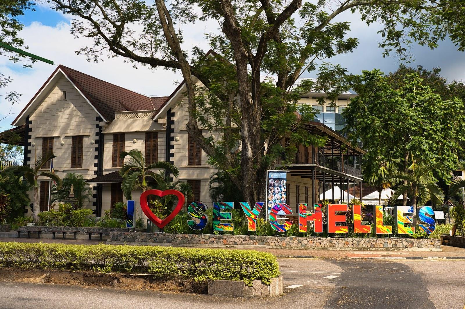 I Love Seychelles sign in front of the National history museum in town Victoria