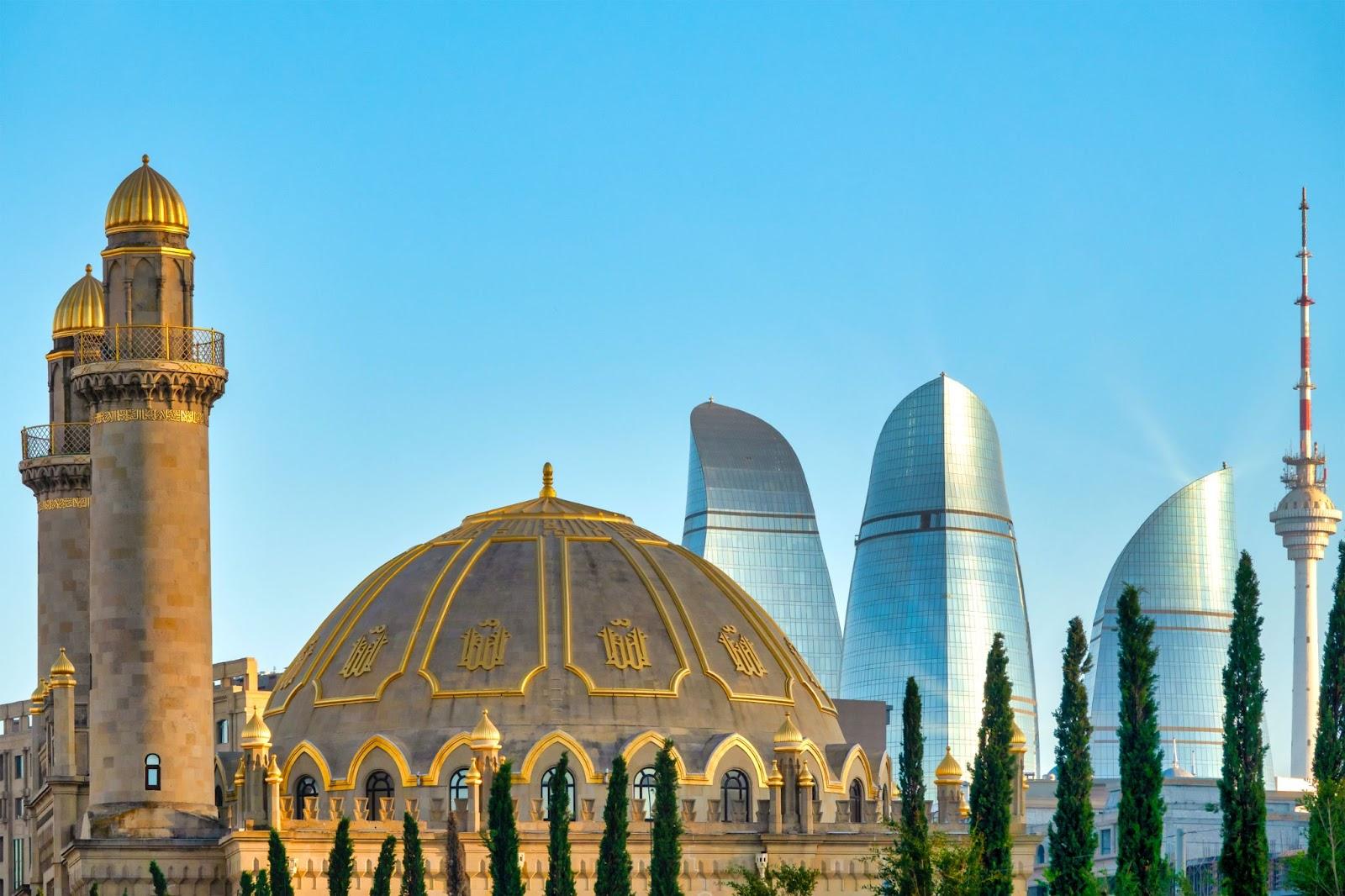 Taza Pir Mosque and Flame Towers - a juxtaposition of time periods 