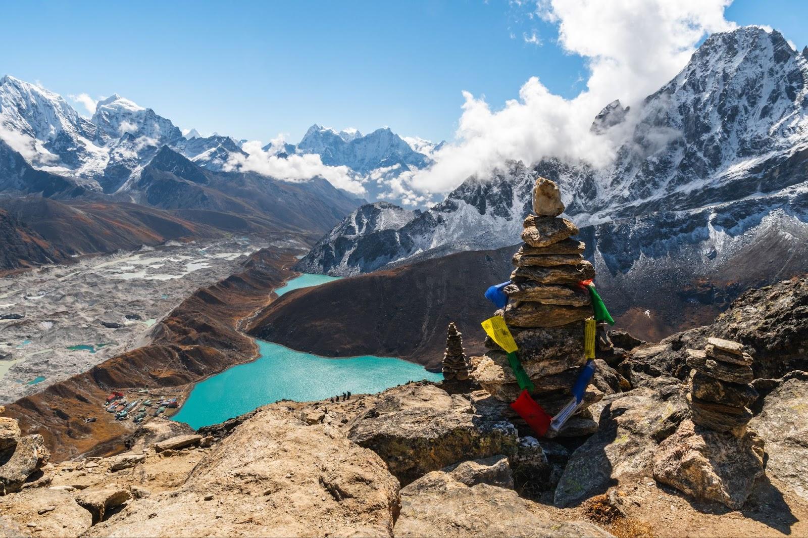 View of Village and Lake Gokyo, snow capped Cholatse, Taboche, Cholatse, Lhotse, Nuptse, Everest, Pumori of the Himalayas and Ngozumpa Glacier. View from Gokyo Ri, Solukhumbu, Sagarmatha, Nepal.

