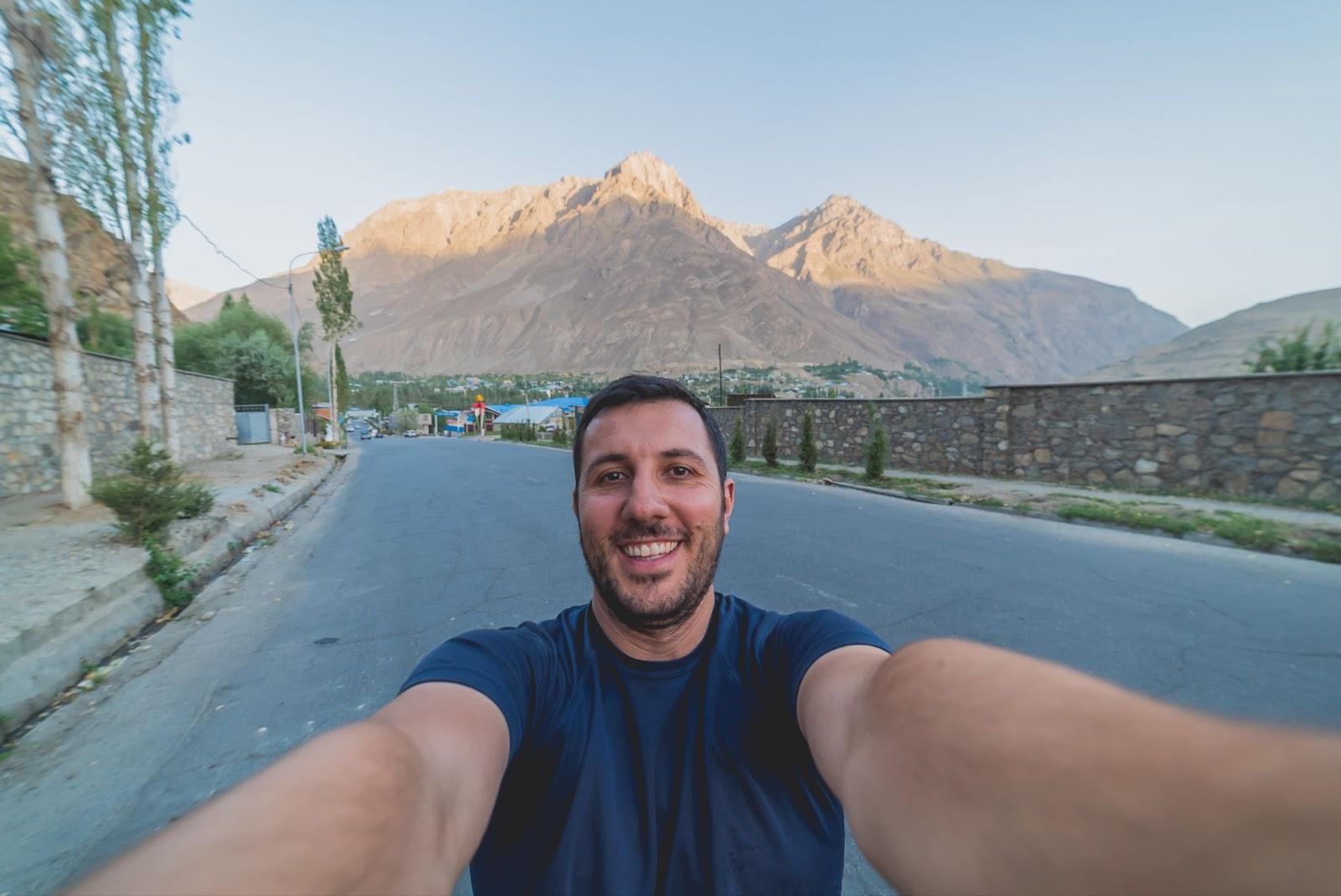 happy tourist take selfie in khorog village in the beautiful Pamir Mountain Range,